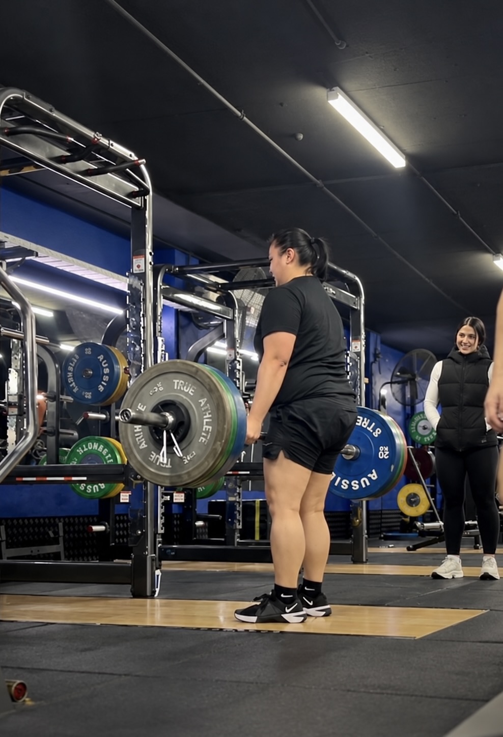 An ARO Strength client completing a deadlift in the gym