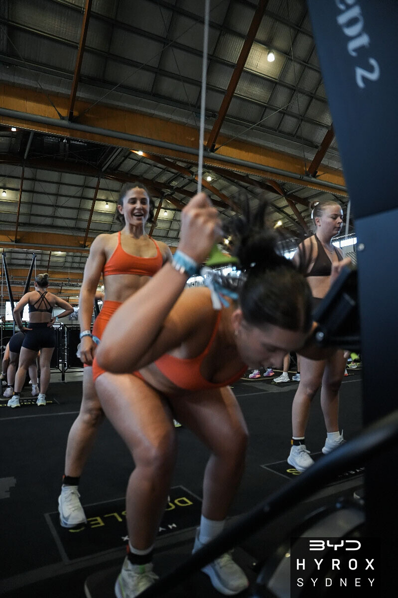 Athletes competing on the SkiErg at HYROX Sydney